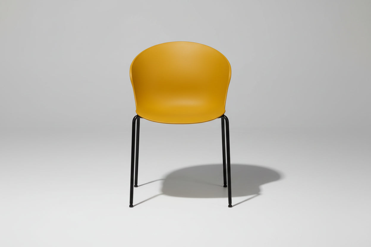 Yellow chair with black legs on a white background