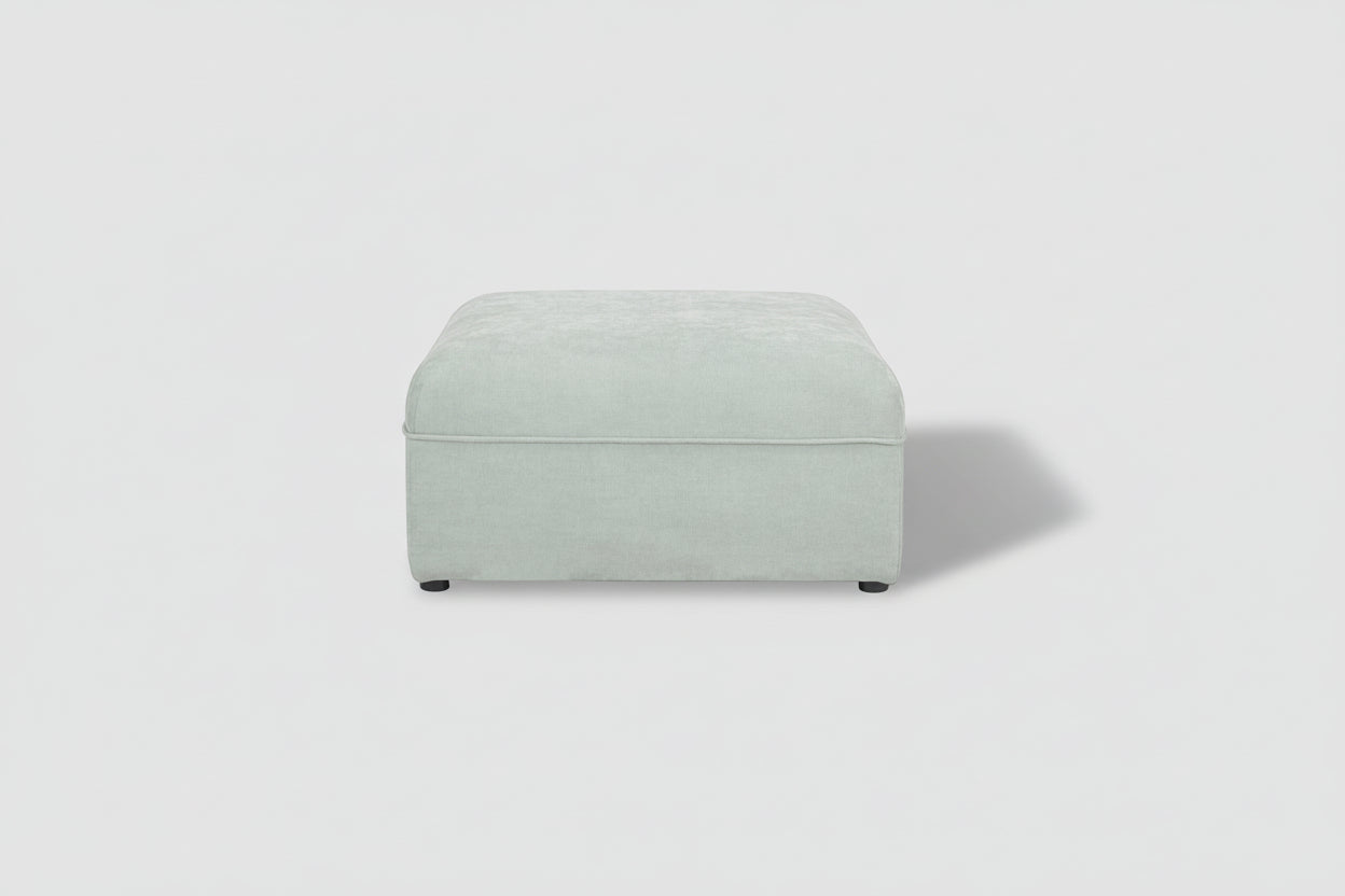 Light gray ottoman on a white background
