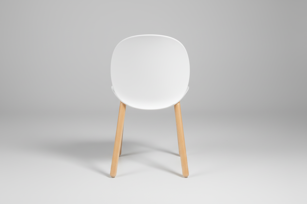 White chair with wooden legs on a white background