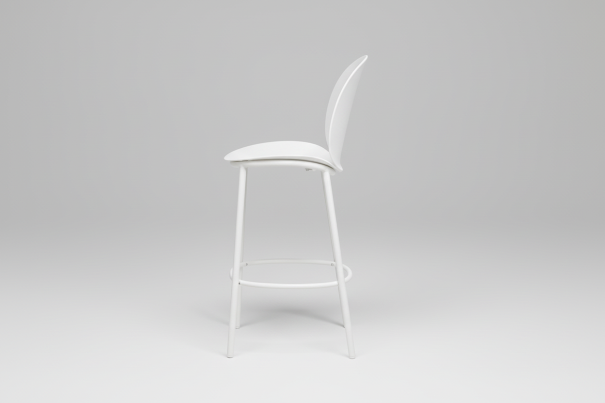 Black bar stool with a beige cushion on a white background