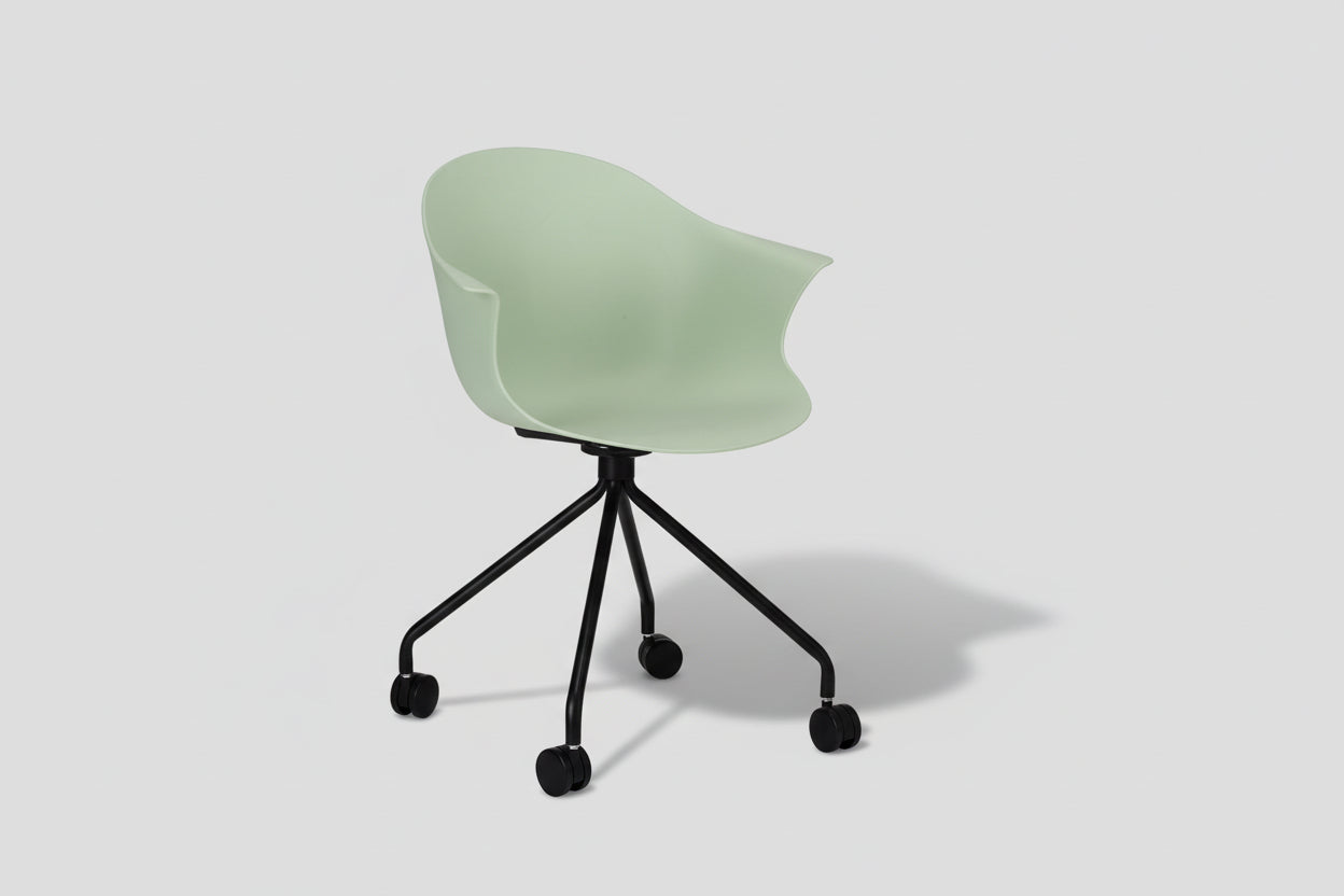 Modern chair with a green seat and black metal frame on a white background