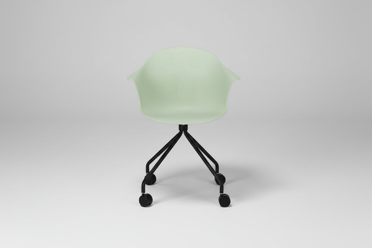 Light green chair with black wheels on a white background