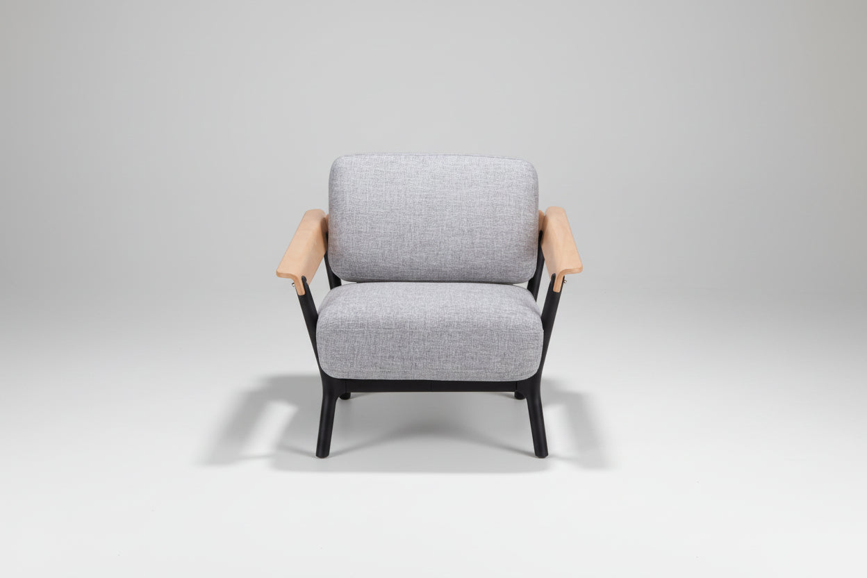 Gray armchair with wooden armrests on a white background