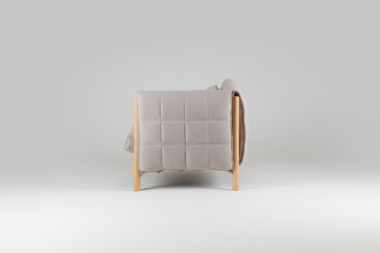 Gray quilted cover on a wooden chair with a white background