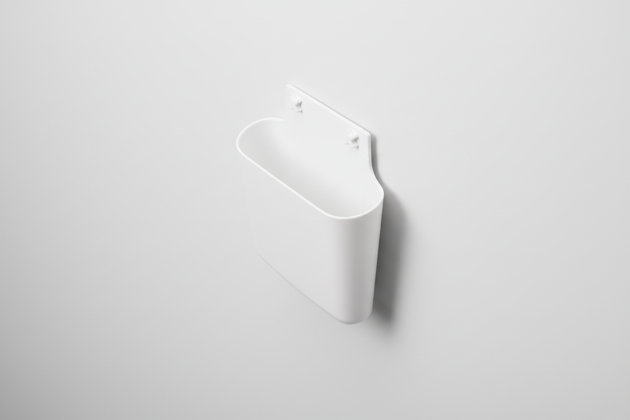 White plastic wall-mounted holder on a white background