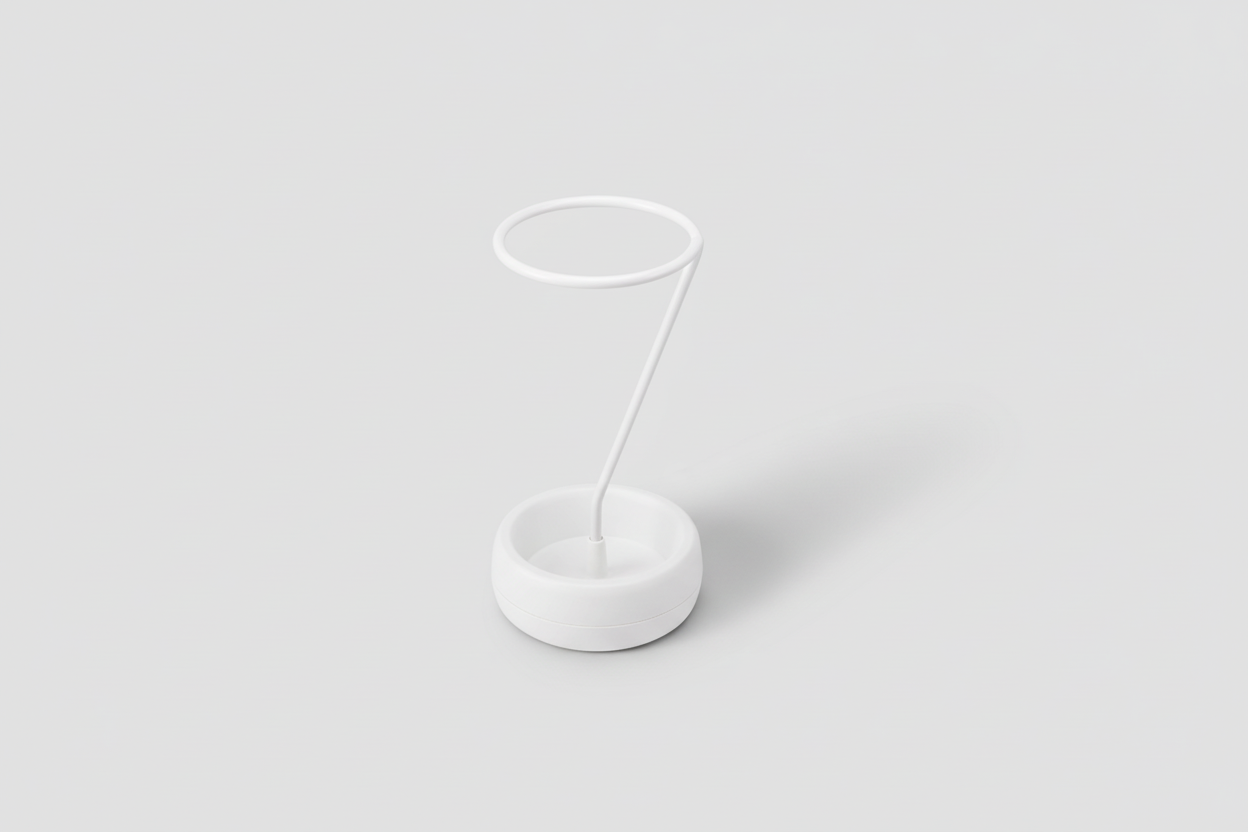 White lamp with a round base and thin stand on a white background
