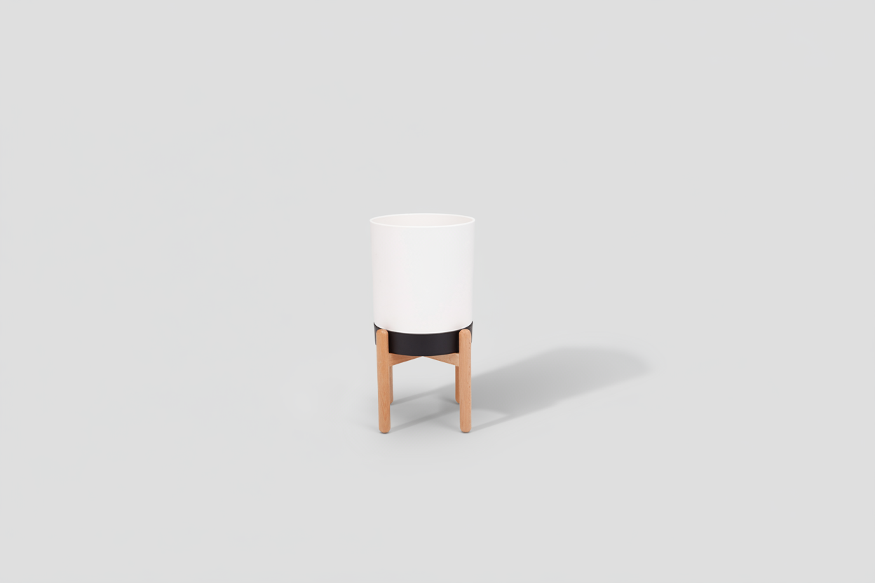 White cylindrical planter with wooden base on a white background