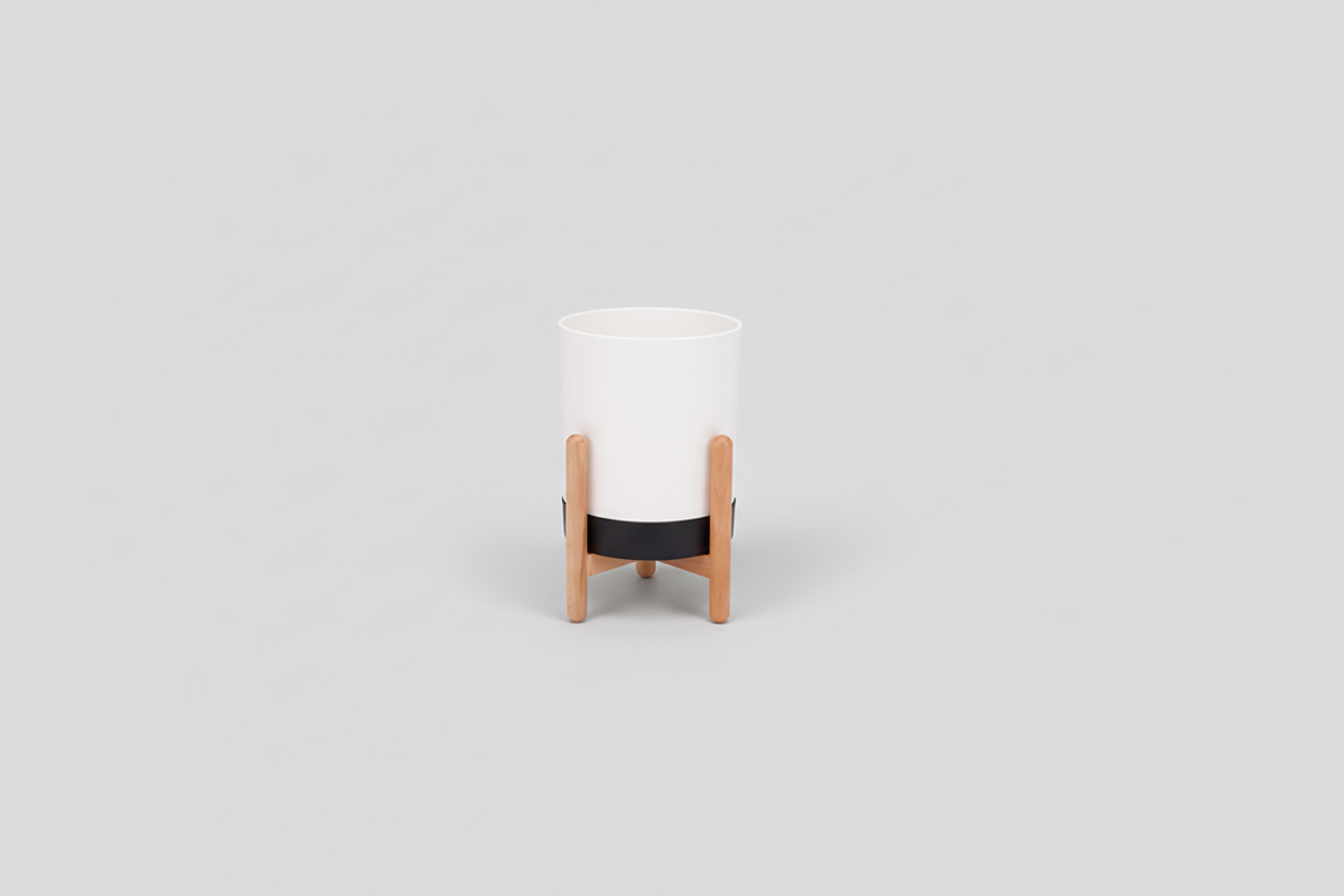 White cylindrical container with wooden base on a white background