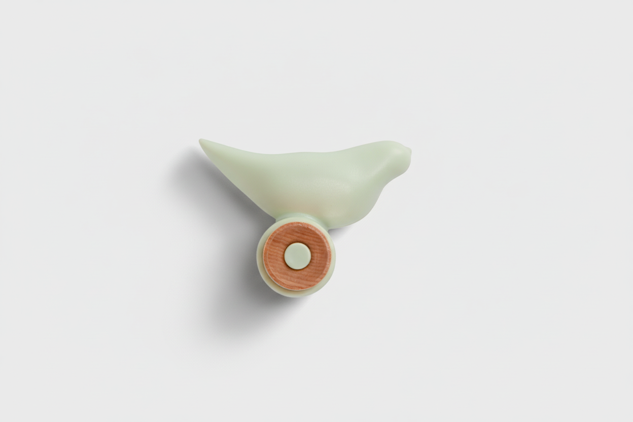 Decorative bird-shaped object with a wooden base on a white background