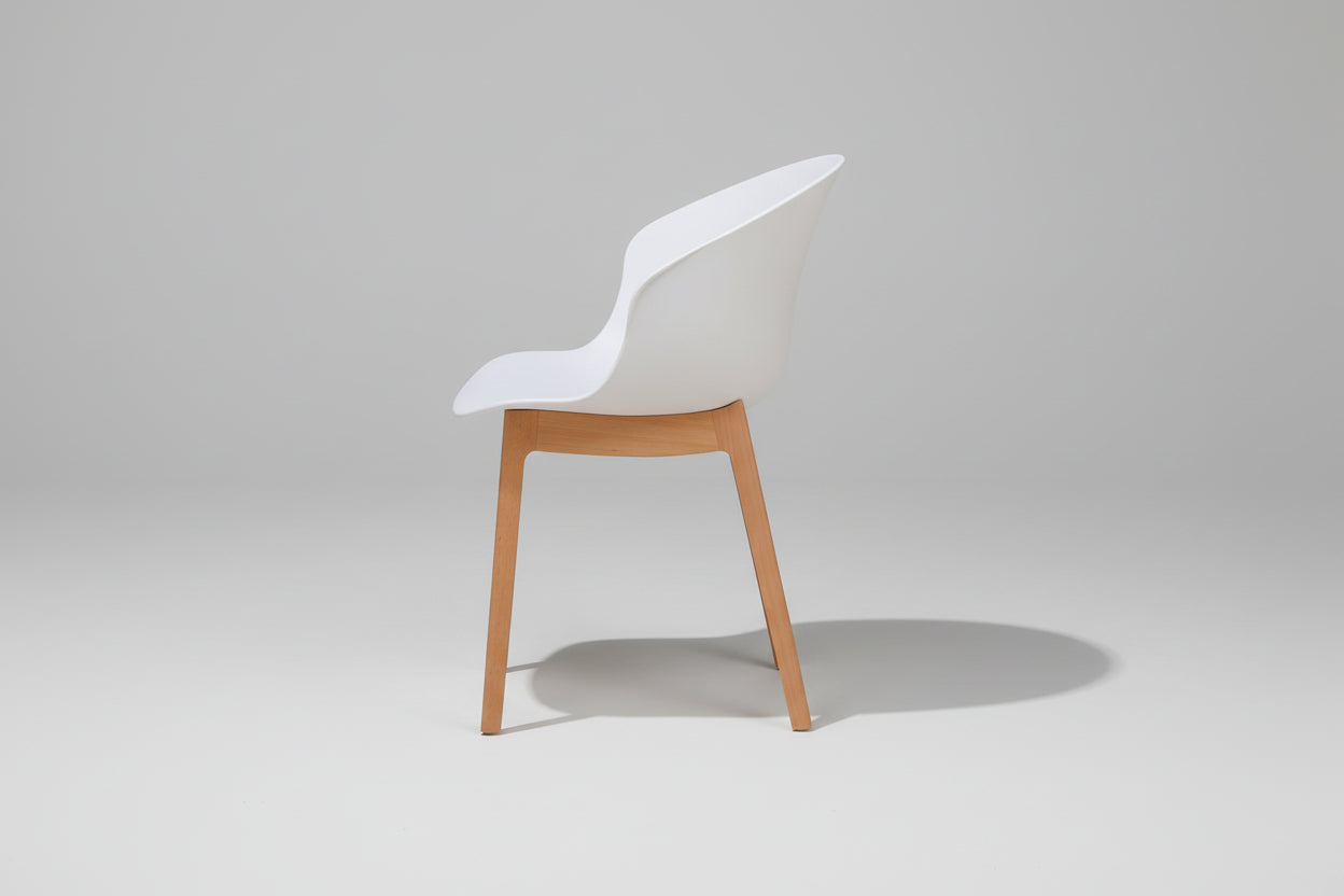 Chair with white backrest and wooden legs on a white background