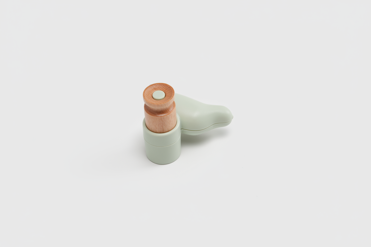 Small ceramic bird figurine with a wooden beak on a white background