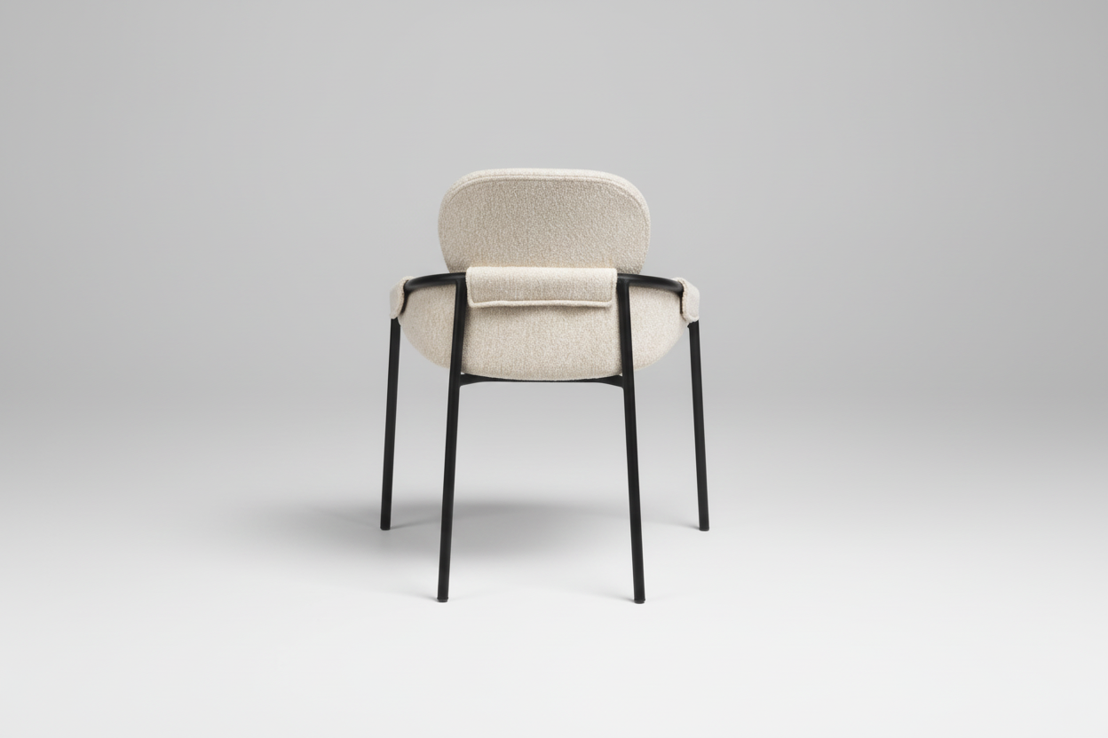 Chair with black frame and beige cushion on a white background