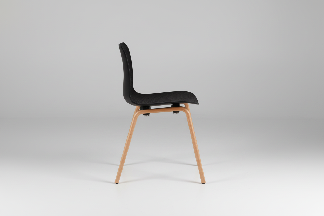 Black chair with wooden legs on a white background