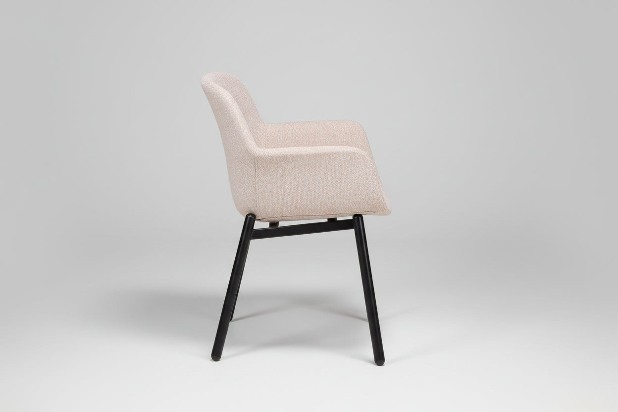 Beige chair with black legs on a white background