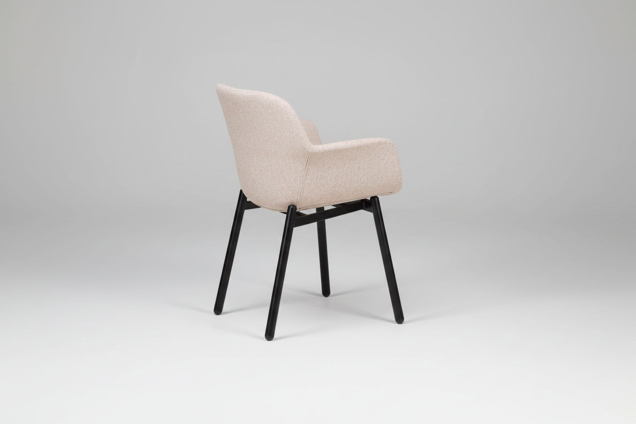 Beige chair with black legs on a white background
